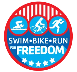 Logo for the Greater Palm Harbor Kids Triathlon 2022. Circle with red outline, bottom of circle is blue fill color and five white stars. Top of circle are white icons on light blue background,  red and white lines above. Text in white reads SWIM BIKE RUN for FREEDOM.