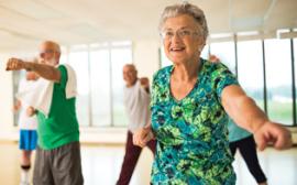 small group of active older adults in fitness class. 