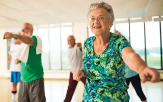 small group of active older adults in fitness class. 