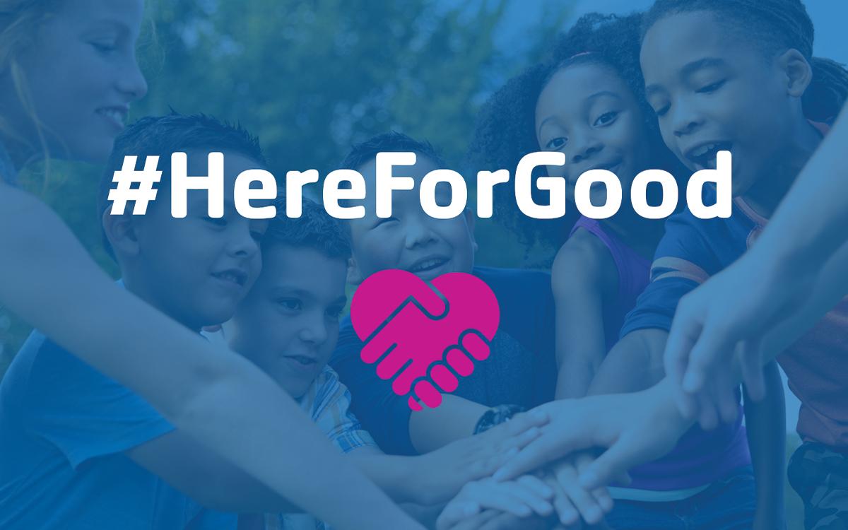 #hereforgood children stacking hands