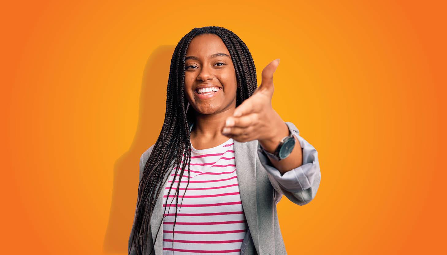 girl over orange background offering handshake