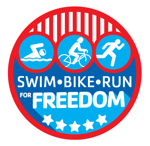 Logo for the Greater Palm Harbor Kids Triathlon 2022. Circle with red outline, bottom of circle is blue fill color and five white stars. Top of circle are white icons on light blue background, red and white lines above. Text in white reads SWIM BIKE RUN for FREEDOM.