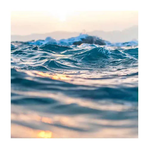 waves at sunset with sun set glimmers