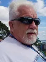 John Geigle headshot wearing sunglasses