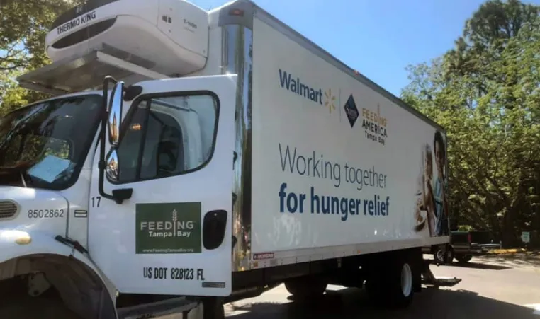 Feeding Tampa Bay truck with the door open