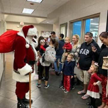 Santa visits the Greater Palm Harbor Y 