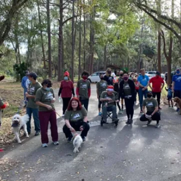 group of people in park for reindeer run 2020 and a few dogs