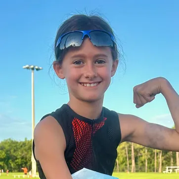 Youth participant in Kids Triathlon at the Greater Palm Harbor YMCA