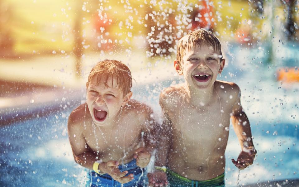 2 boys on splash pad